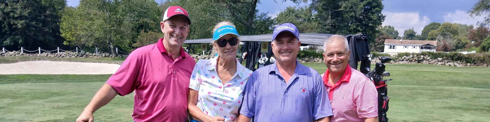 Golfers at the tournament posing for a photo