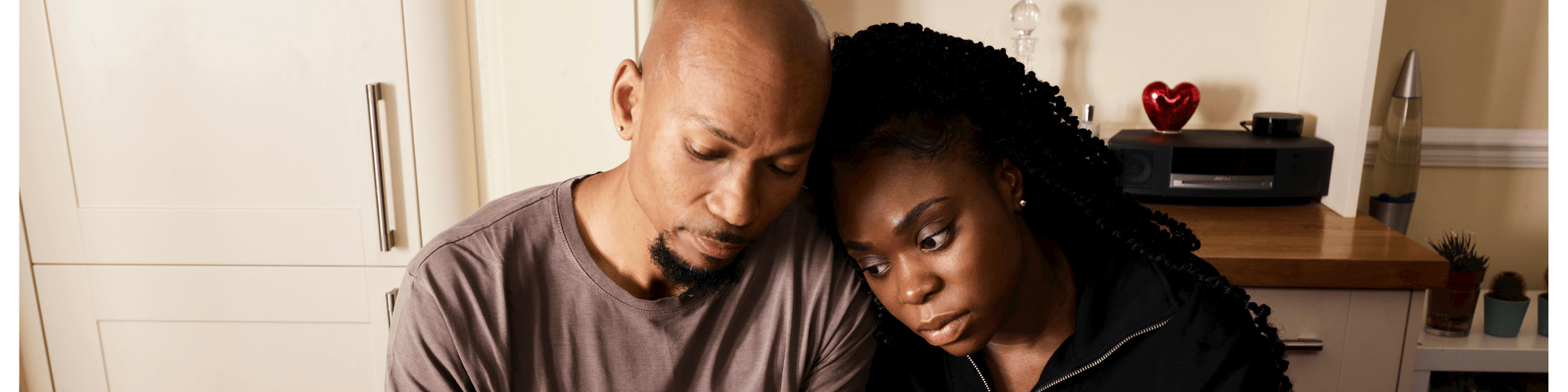 A couple worrying over paying bills